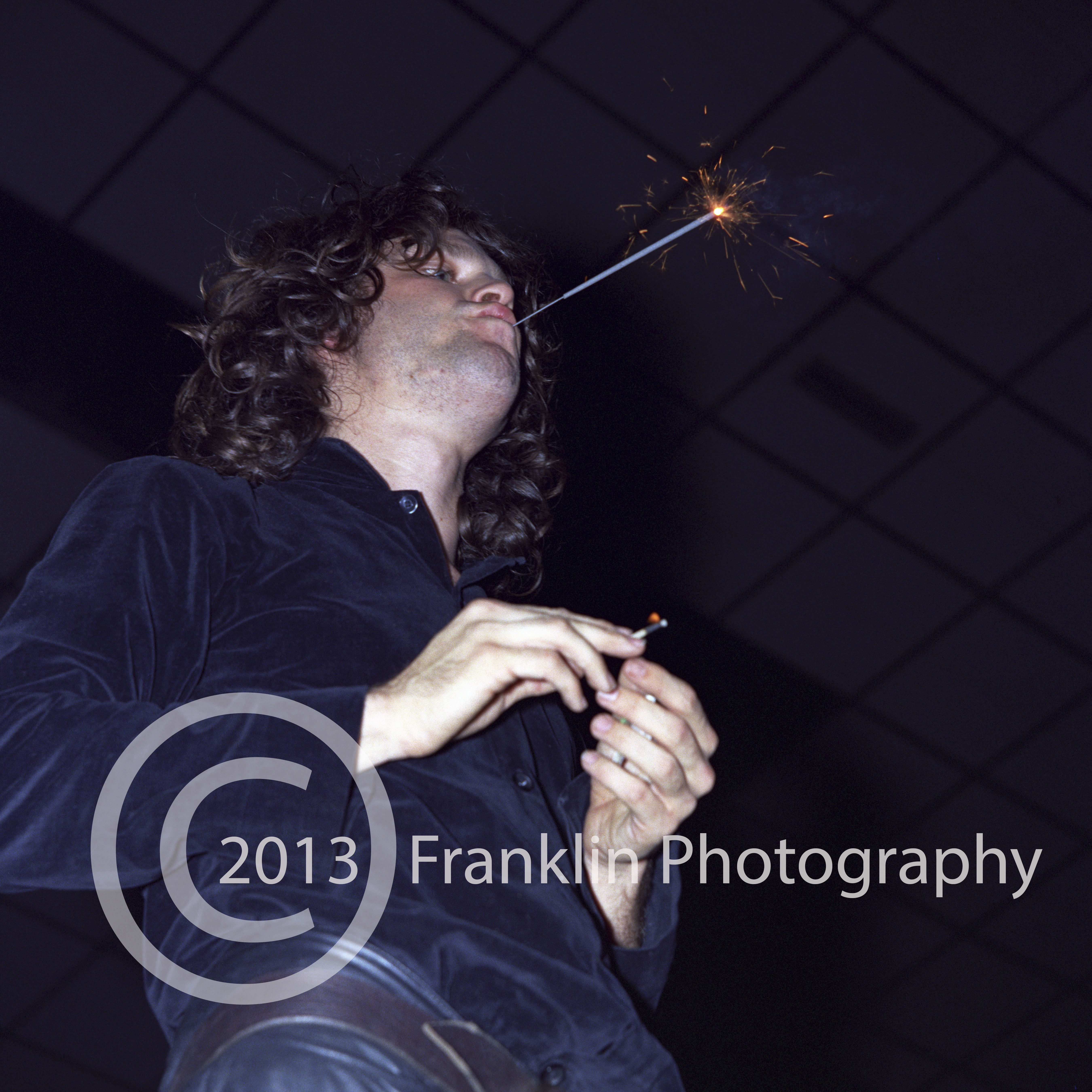 8408 Jim Morrison of The Doors onstage with a lit sparkler in his mouth at the Coliseum in Phoenix Arizona on 2-17-68. Photo by Tom Franklin.